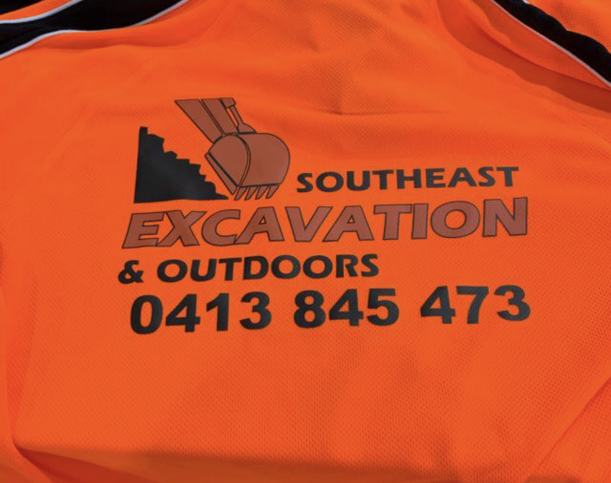 Our work shirt showing the business name and phone number
